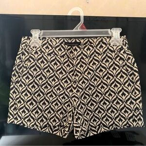 Like brand new. Banana Republic cream and navy blue dress shorts, size 00.